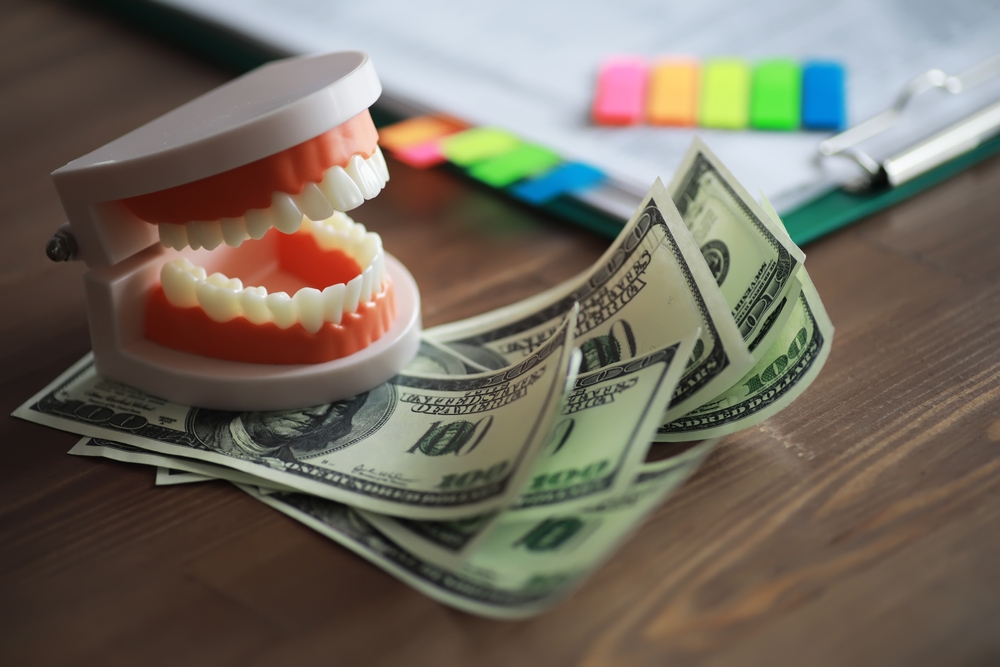 Dental model with US dollar